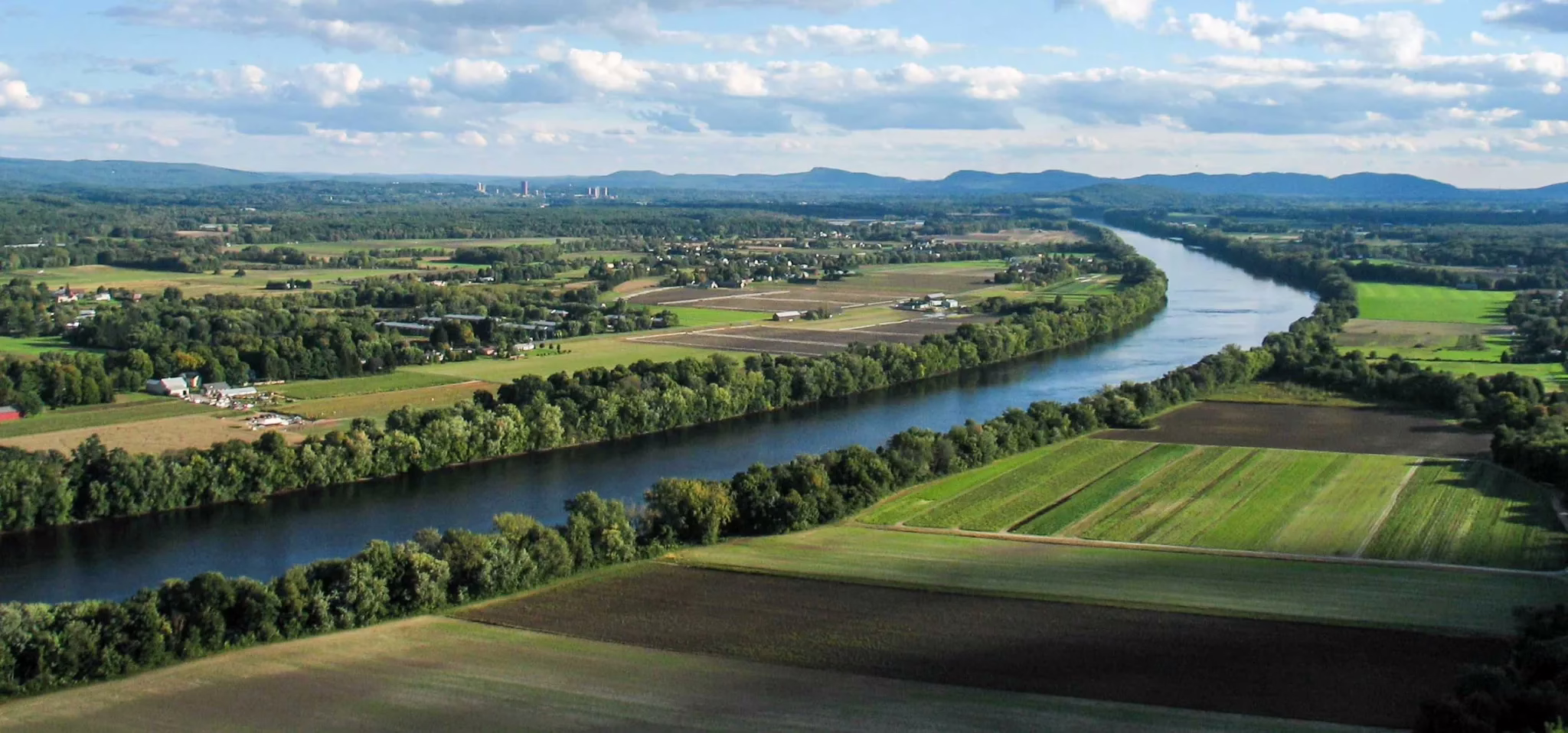 A river and farm land.