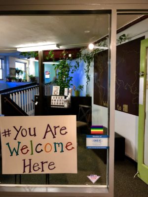 ILI's main office door with sign that says "you are welcome here".