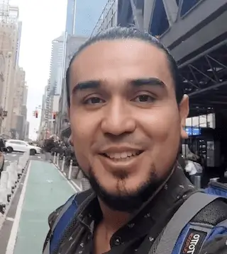 A selfie of Edwin Cubillos in New York City out on a busy street.