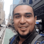 A selfie of Edwin Cubillos in New York City out on a busy street.