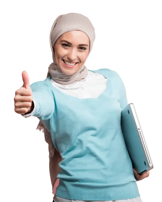 A smiling woman in a head scarf giving the thumbs up sign and holding a laptop computer.