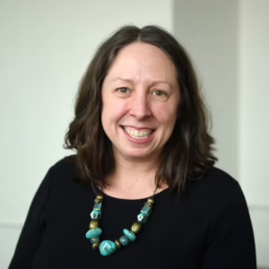 A portrait of Laura Robinson, Free English Program Assistant Director at ILI.