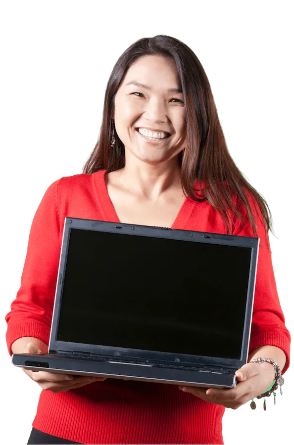 A woman smiling while holding a laptop computer.