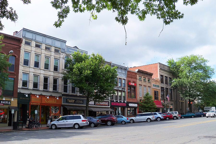 A city street with parked cars.