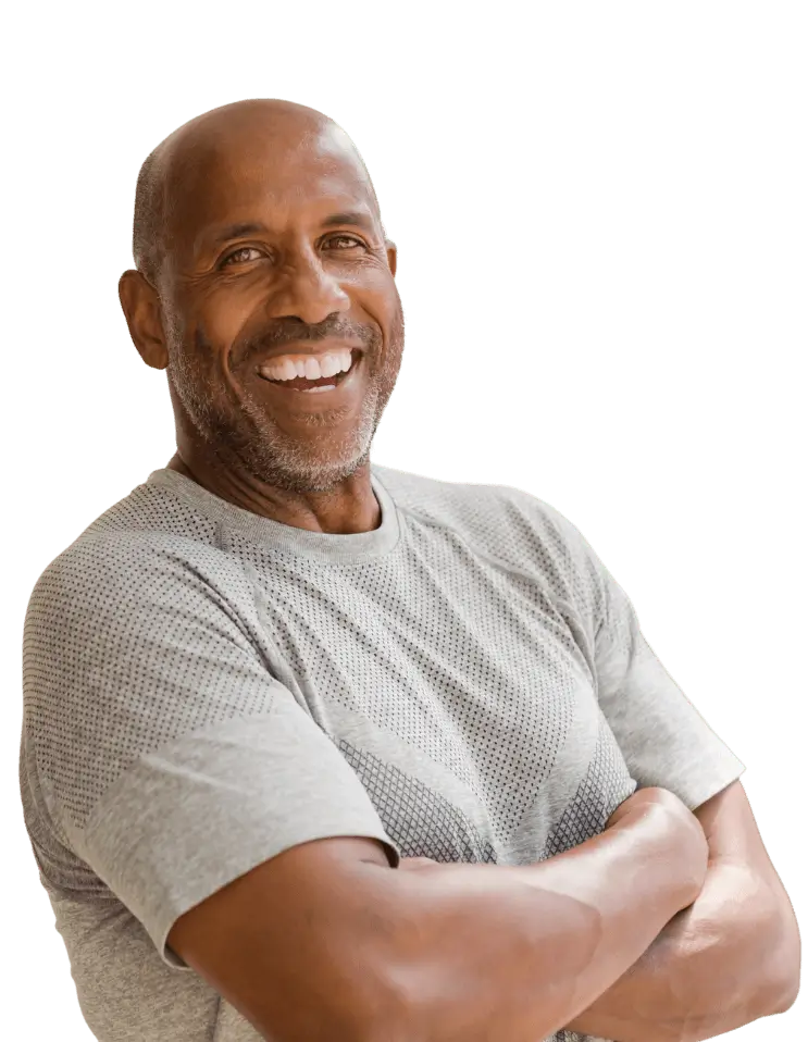 Confident and happy African American man with arms crossed and a big smile.