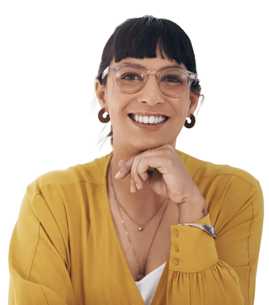 Woman in a yellow blouse smiling with glasses on.