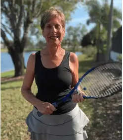 A woman holding a tennis racket.