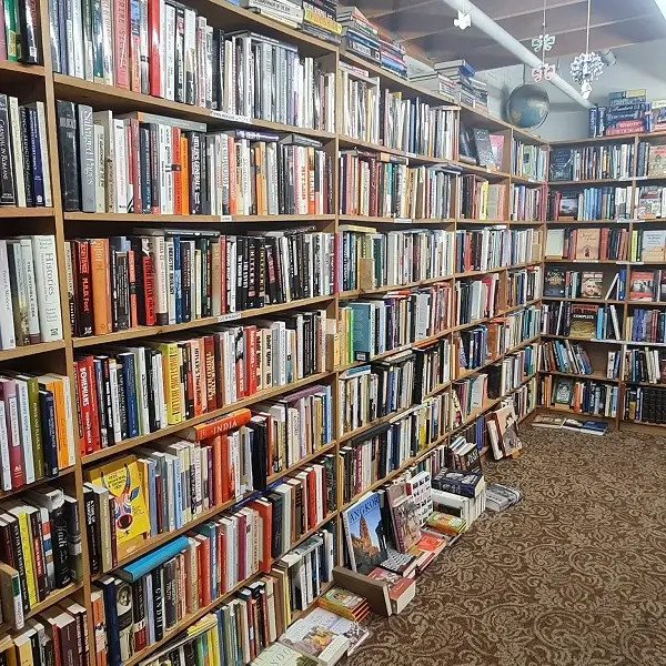 Bookshelves filled with many books.