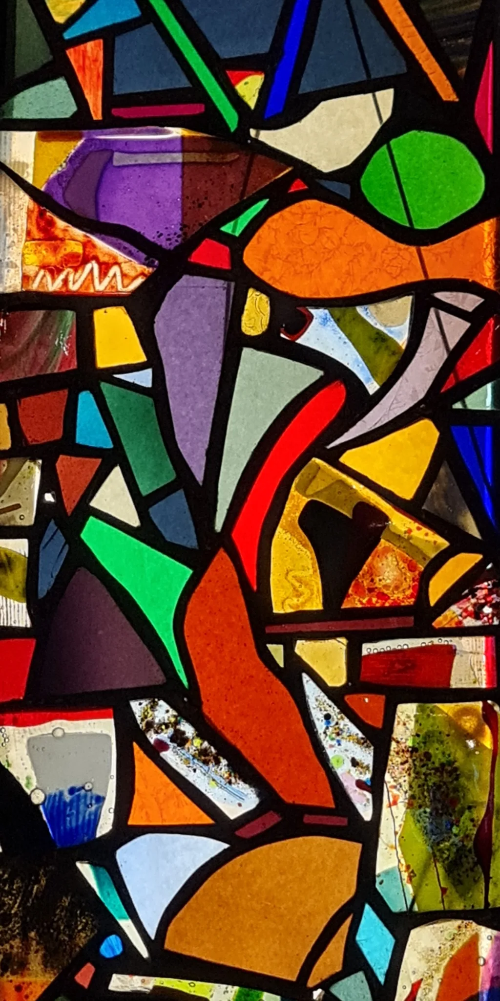 A colorful modern stained glass window.