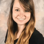 A woman with long hair smiling