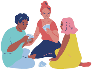 Three people sitting together and playing cards.