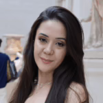 Woman looking at the camera smiling.