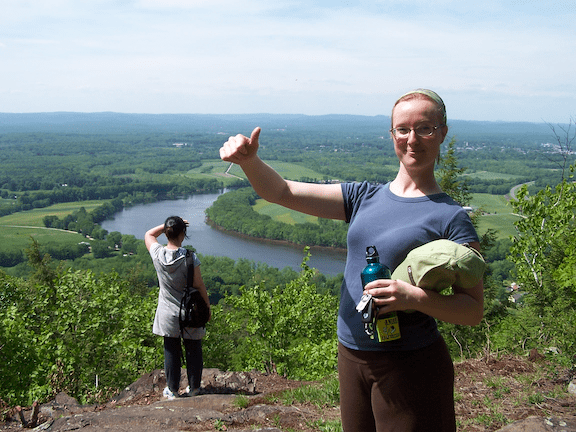 Woman overlooking a river with a friend.