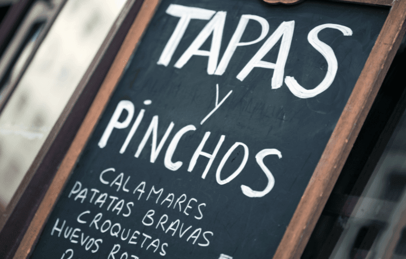 A sign reading "Tapas y Pinchos"