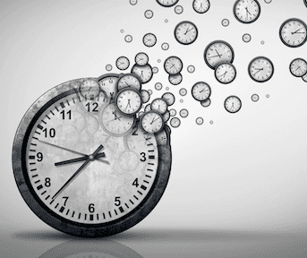 A clock with lots of clock bubbles floating up.
