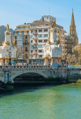 a bridge with building behind.
