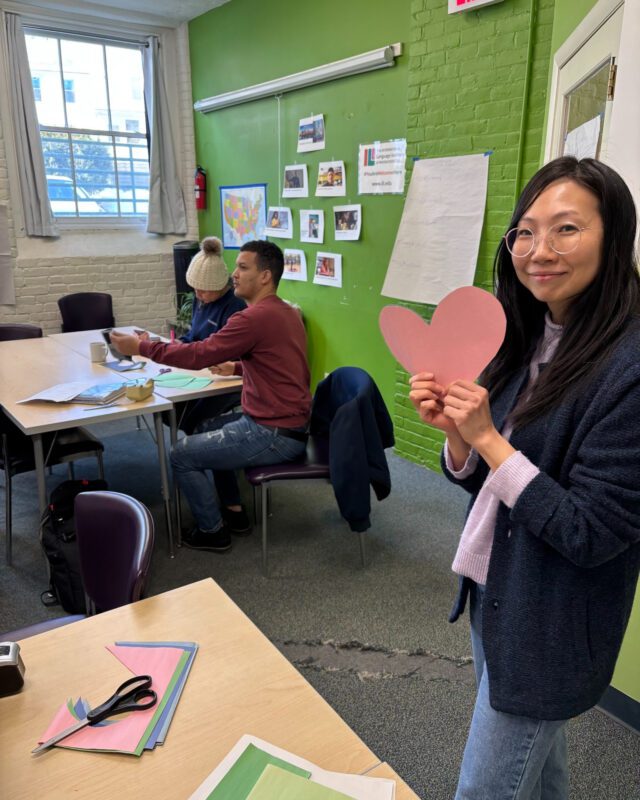 Students with a paper heart.