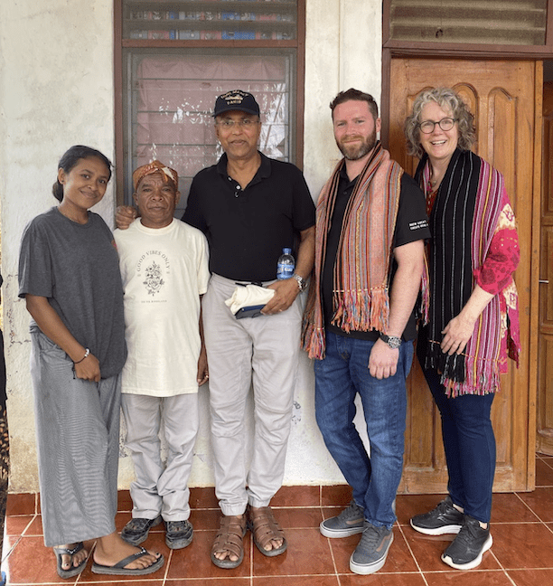 Five people standing for a photo.