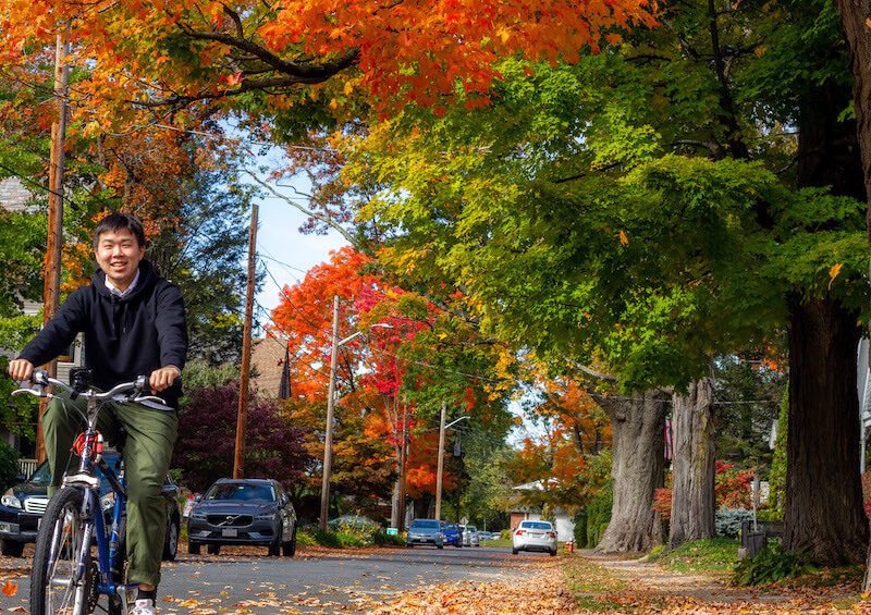 IEP student riding a bike in the fall