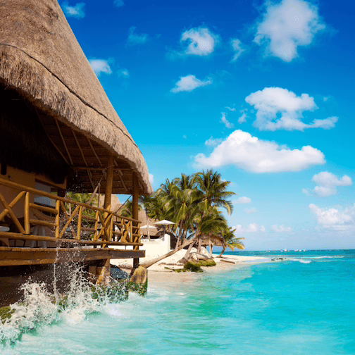a beautiful beach and palapa in Playa del Carmen, Mexico.