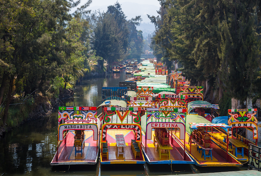 The Xochimilco canals with boats in Mexico City.