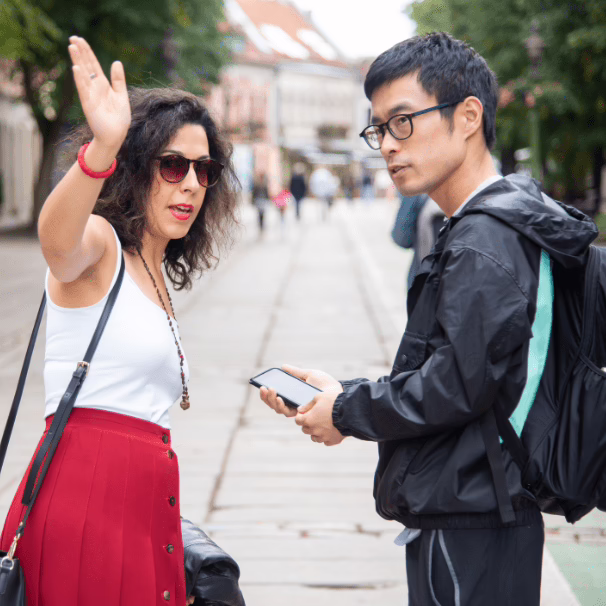 A woman giving a man directions.