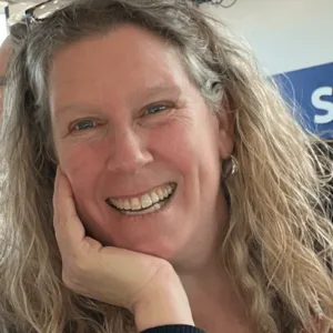 A woman smiling at the camera